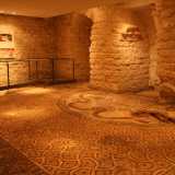 Rappresenta un vero e proprio capolavoro il �mosaico di Timoteo�, un pregiato pavimento realizzato con piccole tessere policrome, costituito da un vasto campo centrale, con motivo a scaglie, racchiuso da una cornice decorata con animali acquatici e pesci